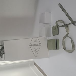 Van cleef packaging with ribbon and travel pouch